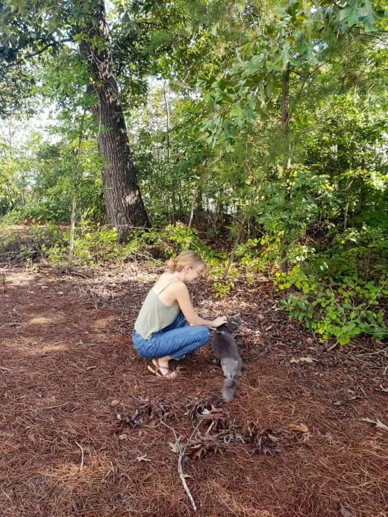 girl and her cat outside 